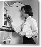 Teen Girl At Medicine Cabinet, C.1950s Metal Print