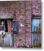 A Child Sitting On A Window Metal Print