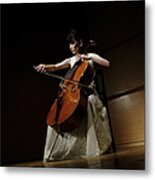 A Female Cellist Playing Cello On Stage Metal Print