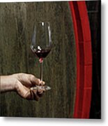 A Human Hand Holding A Glass Of Red Wine Metal Print