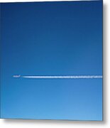 A Plane And Vapor Trails In The Sky Metal Print