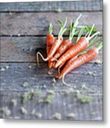 Baby Carrots On Rustic Table Metal Print
