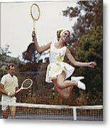 Couple On Tennis Court, Woman Jumping Metal Print