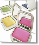 Four Brightly Colored Eyeshadows In Metal Print
