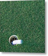 Golf Ball Going Into Hole Metal Print