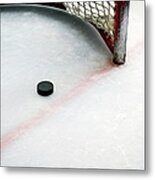 Hockey Puck In Goal And Red Line Metal Print