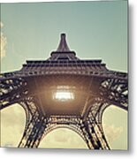 Light Shining Through Eiffel Tower Metal Print