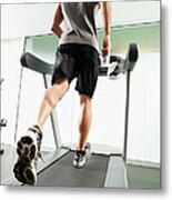Mixed Race Man Running On Treadmill Metal Print
