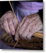 Senior Woman Knitting A Traditional Basket With Reeds Metal Print