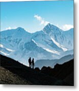 Silhouette Couple Holding Hands While Hiking On Mountain Against Blue Sky Metal Print