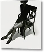Silhouetted Woman On Chair Metal Print