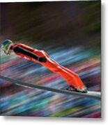 Ski Jumper In Mid-air Against Blurred Metal Print