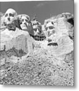 View Of Sculptured Faces Of Former Metal Print