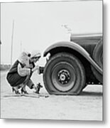 Woman Changing Flat Tire On Car Metal Print