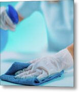 Woman Disinfecting Surface Metal Print