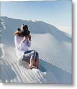 Woman Wearing Hat Sitting On Desert At White Sands National Monument During Sunny Day Metal Print
