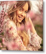 Amazing young woman posing in apricot tree orchard at spring Metal Print