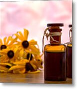 Amber Aromatherapy Bottle With Flower Background Metal Print