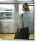 Caucasian Woman Standing Near Passing Subway In Train Station #1 Metal Print