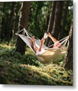 Man In A Hammock Reading A Book On A Tablet #1 Metal Print