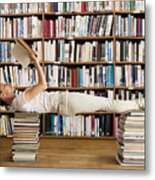 Woman In Library Reads Book And Holds Yoga Pose #1 Metal Print
