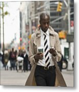 Black Businessman Using Cell Phone On City Street #3 Metal Print