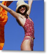 A Young Attractive Caucasian Female In A Swimsuit Hat And Sunglasses Walks And Plays At The Beach Metal Print