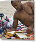 African Man Reading Book On Beach Metal Print