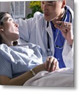 An Asian Doctor Advises A Caucasian Female As She Lies In A Bed In A Recovery Room Metal Print