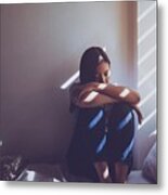 Asian Women Are Sitting Hugging Their Knees In Bed. Feeling Sad, Disappointed In Love In The Dark Bedroom And Sunlight From The Window Through The Blinds.vintage Tone. Metal Print