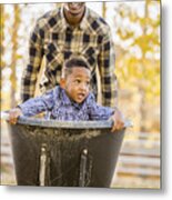 Black Father Pushing Son In Wheelbarrow In Autumn Leaves Metal Print
