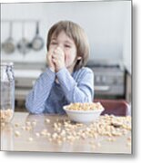 Boy Eating Bowl Of Cereal In Kitchen Metal Print