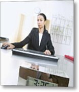 Businesswoman Sits At Desk With An Alarm Clock On It Using A Computer Mouse Metal Print