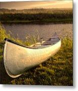 Canoe In Evening Light At The River Bank Metal Print