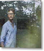 Casual Young Businessman Behind Windowpane In Office Metal Print
