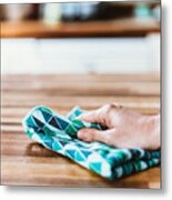 Close-up Of Woman Hand Cleaning The Surface Of A Table With A Cleaning Cloth At Home Metal Print