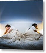 Couple Ignoring Each Other On Bed Metal Print