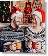 Couple Relaxing And Drinking Tea In Front Of A Christmas Tree Metal Print