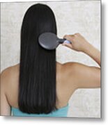 Dark-haired Woman Brushing Her Hair, Rear View Metal Print