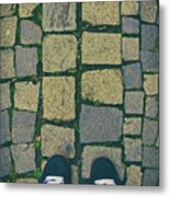 Feet In Urban Sneakers On Cobblestones Metal Print