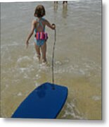 Girl (5-7) Walking Into Surf, Pulling Float, Rear View Metal Print