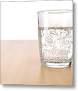 Glass Of Sparkling Water On Table Metal Print