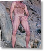 Handsome And Sexy Hairy Man Stands In Front Of A Rocky Hillside. Metal Print