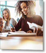 Happy Female College Student Reading A Book On A Class. Metal Print