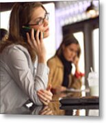 Lifestyle Photograph Of An Attractive Caucasian Female As She Talks On A Cell Phone In A Cafe Metal Print