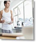 Man Eating Cereal In Kitchen Metal Print