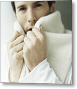 Man Holding Sweater Around Neck, Covering Part Of Face Metal Print