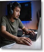 Millennial Man Playing Computer Game On Laptop At Home. Metal Print