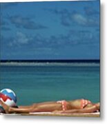 Model Lying on the Beach in a Polka Dot Bikini Metal Print