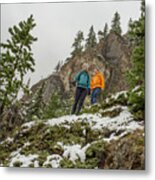 Mother And Son Hike On Snowy Mountainside Metal Print